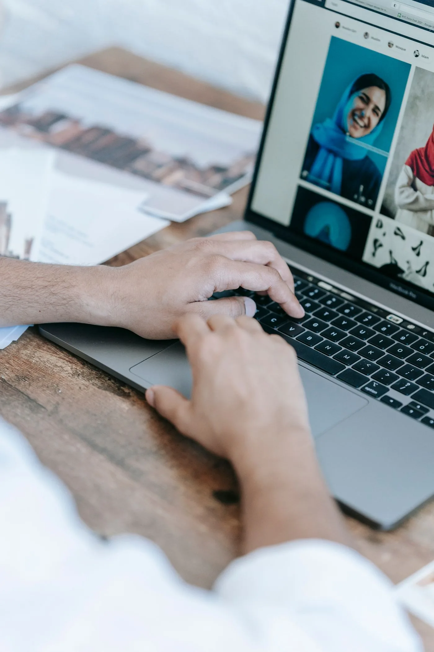 A person editing photographs on a laptop.